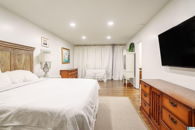 bedroom featuring light hardwood / wood-style floors