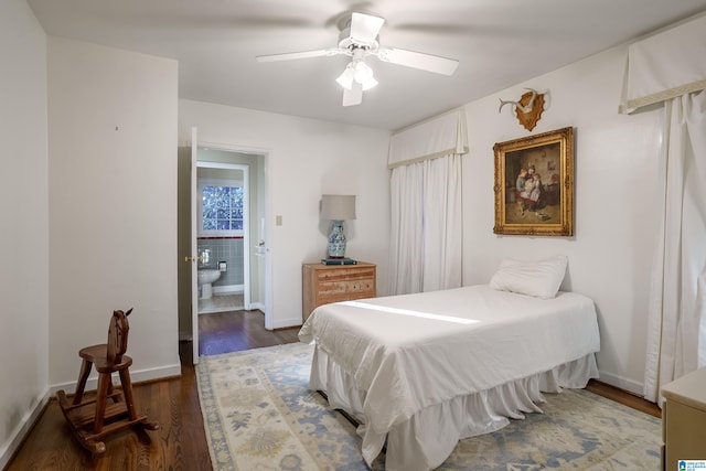 bedroom featuring connected bathroom, ceiling fan, and dark hardwood / wood-style floors