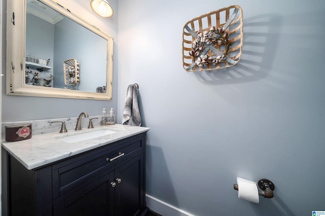 bathroom with vanity and crown molding