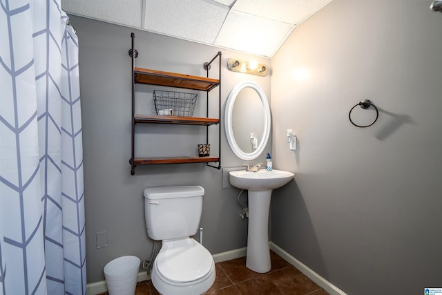 bathroom featuring tile patterned floors, toilet, and sink