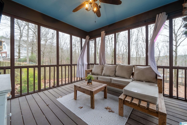 sunroom / solarium featuring ceiling fan