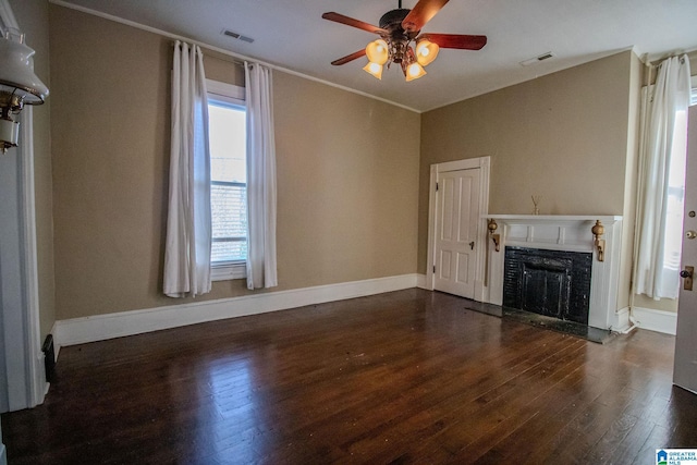 unfurnished living room featuring dark hardwood / wood-style floors and ceiling fan