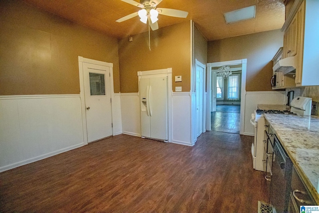 interior space with ceiling fan and dark hardwood / wood-style flooring