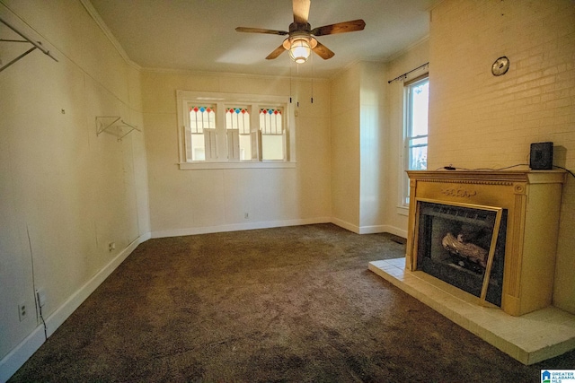 unfurnished living room featuring carpet flooring, ceiling fan, and ornamental molding