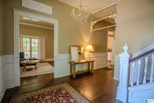 interior space with stairs, a wainscoted wall, dark wood-type flooring, and crown molding