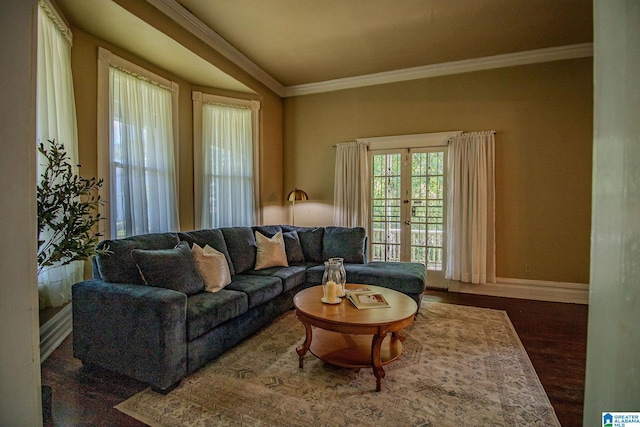 living room featuring baseboards, crown molding, french doors, and wood finished floors