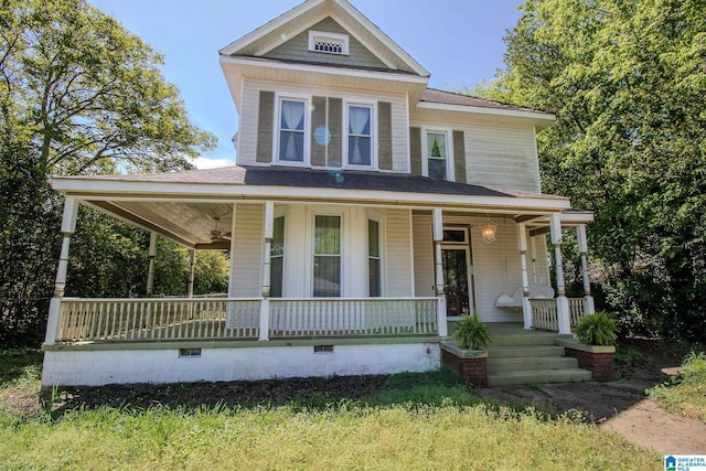 view of front of home with a ceiling fan, a porch, and crawl space