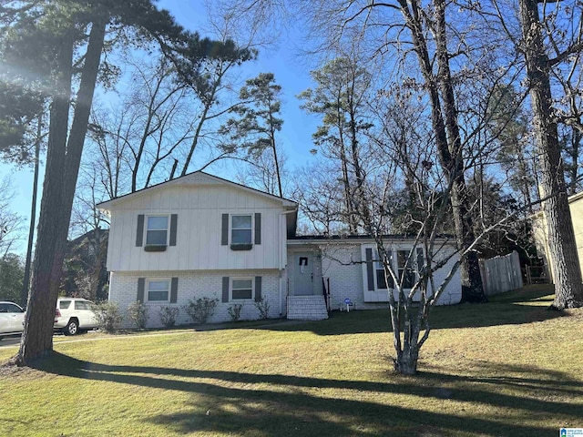 split level home with a front yard