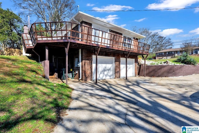 view of front of property with a garage and a deck