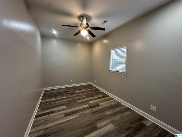 unfurnished room with dark hardwood / wood-style flooring, vaulted ceiling, and ceiling fan