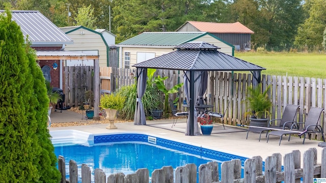 view of pool featuring a gazebo and a patio