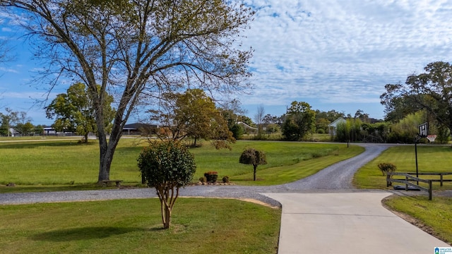 surrounding community featuring a lawn