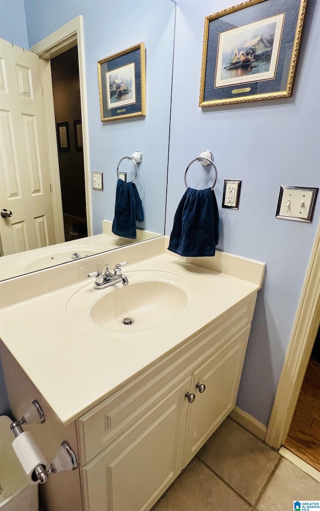 bathroom featuring tile patterned flooring and vanity