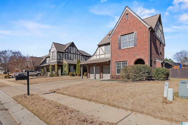 english style home with a garage