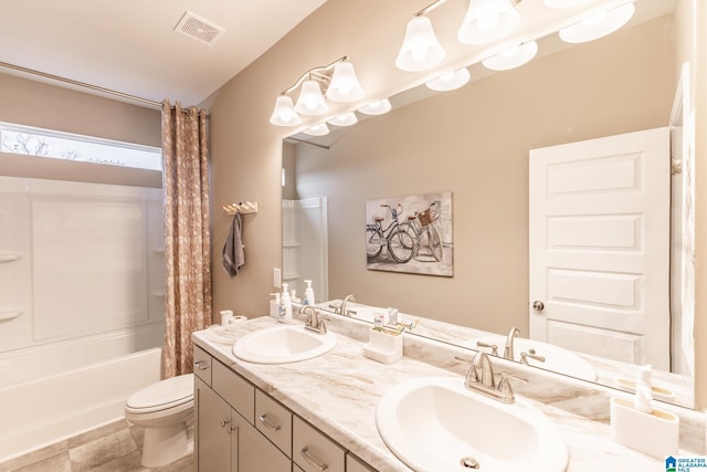 full bathroom with shower / bath combo, toilet, and vanity