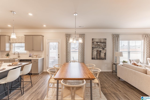 dining space featuring light hardwood / wood-style flooring, plenty of natural light, and sink