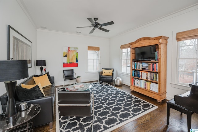 living area featuring crown molding, ceiling fan, and dark hardwood / wood-style floors