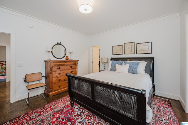 bedroom featuring dark hardwood / wood-style flooring and ornamental molding