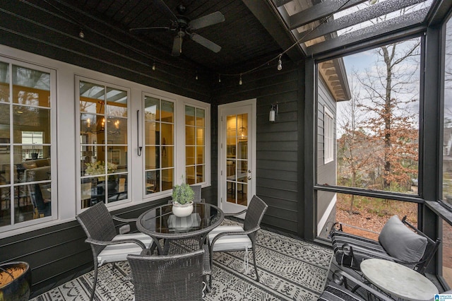 sunroom / solarium featuring ceiling fan