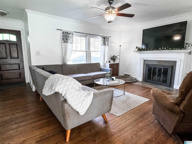 living room with ceiling fan, dark hardwood / wood-style flooring, and crown molding