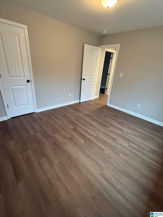 empty room featuring dark hardwood / wood-style floors