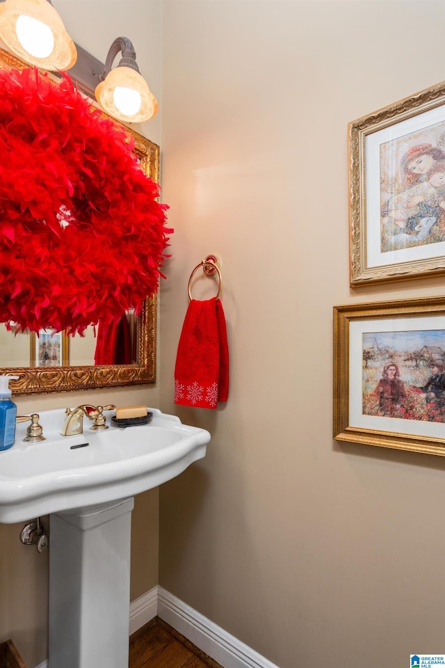 bathroom featuring hardwood / wood-style flooring and sink