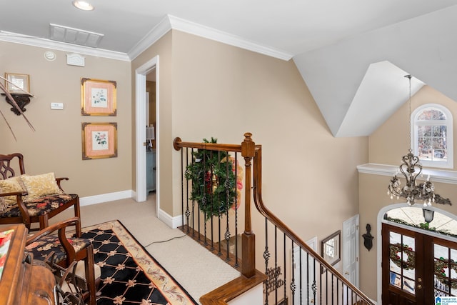 interior space featuring crown molding, french doors, vaulted ceiling, and a notable chandelier