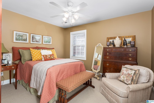 bedroom featuring light carpet and ceiling fan