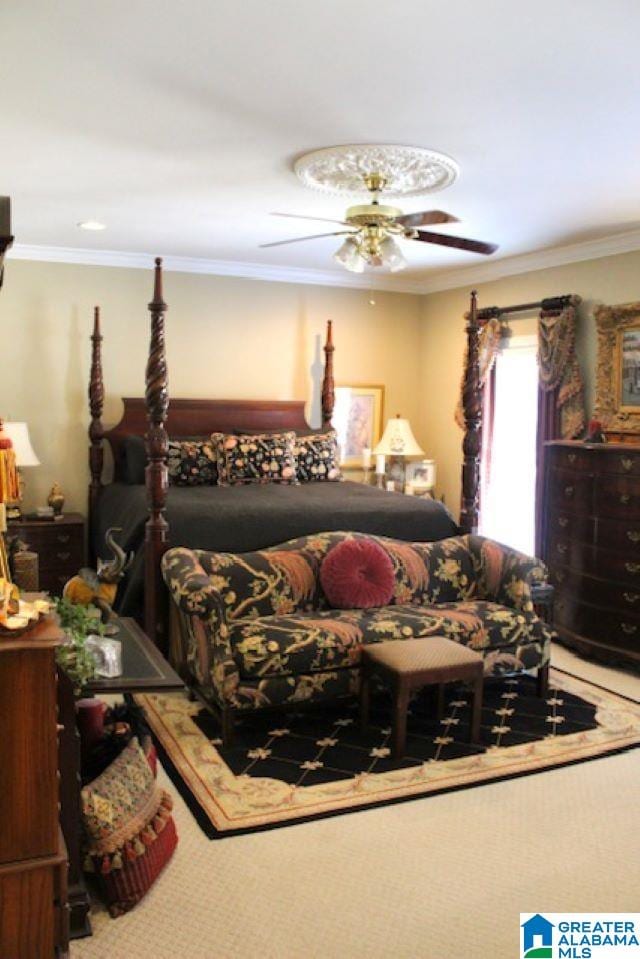 bedroom with ceiling fan, carpet floors, and crown molding