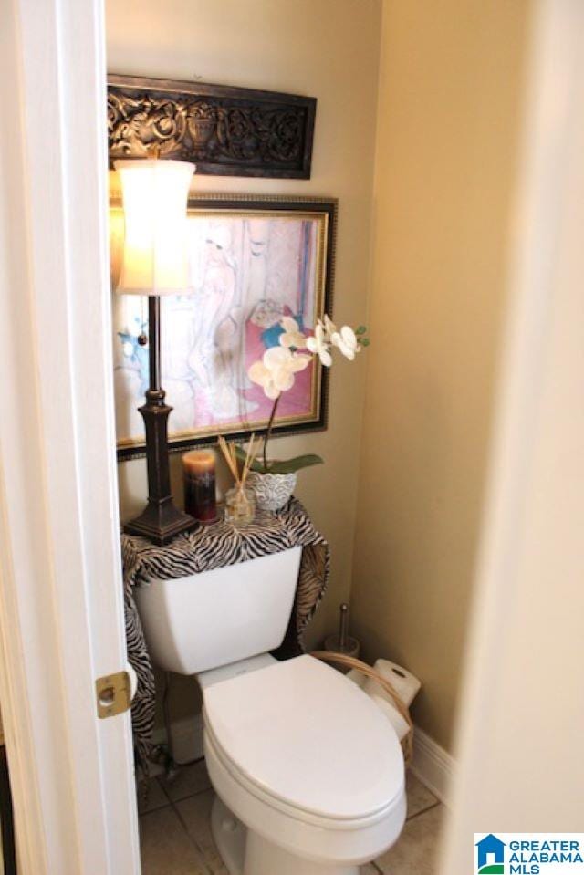 bathroom with tile patterned floors and toilet