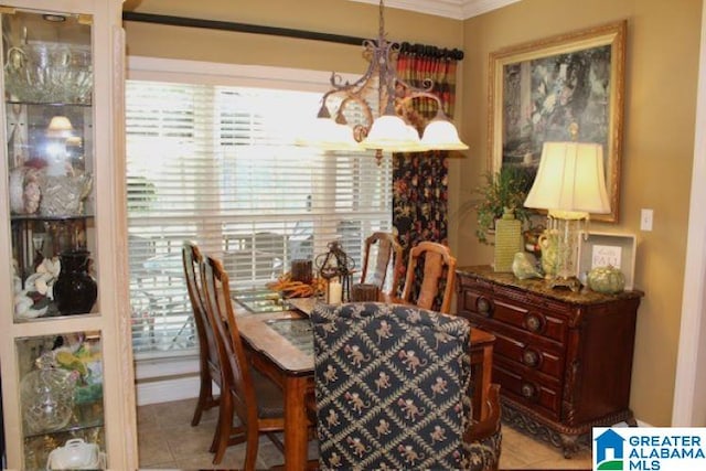 dining room featuring a notable chandelier and crown molding