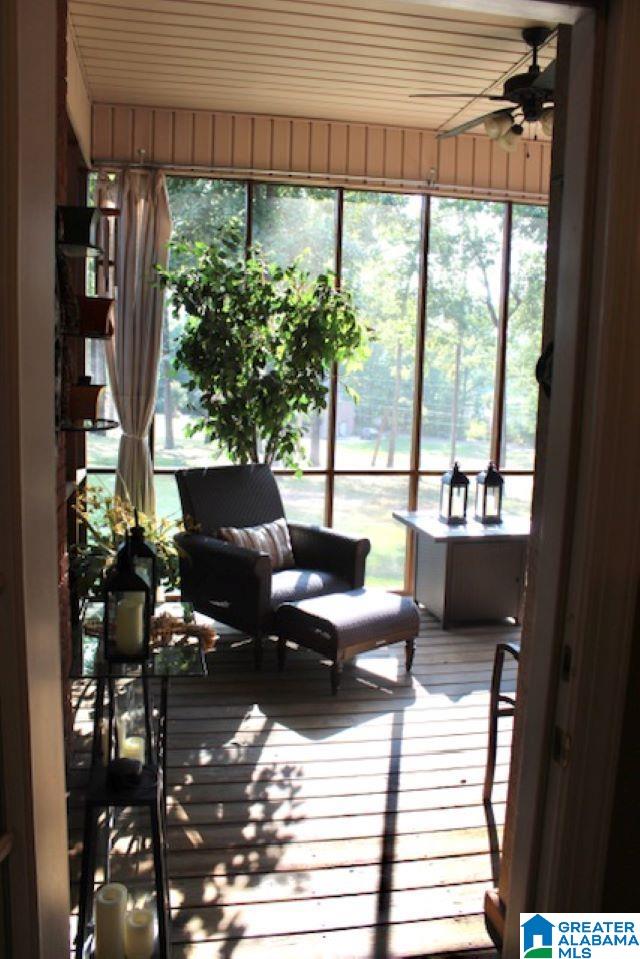 sunroom / solarium with ceiling fan