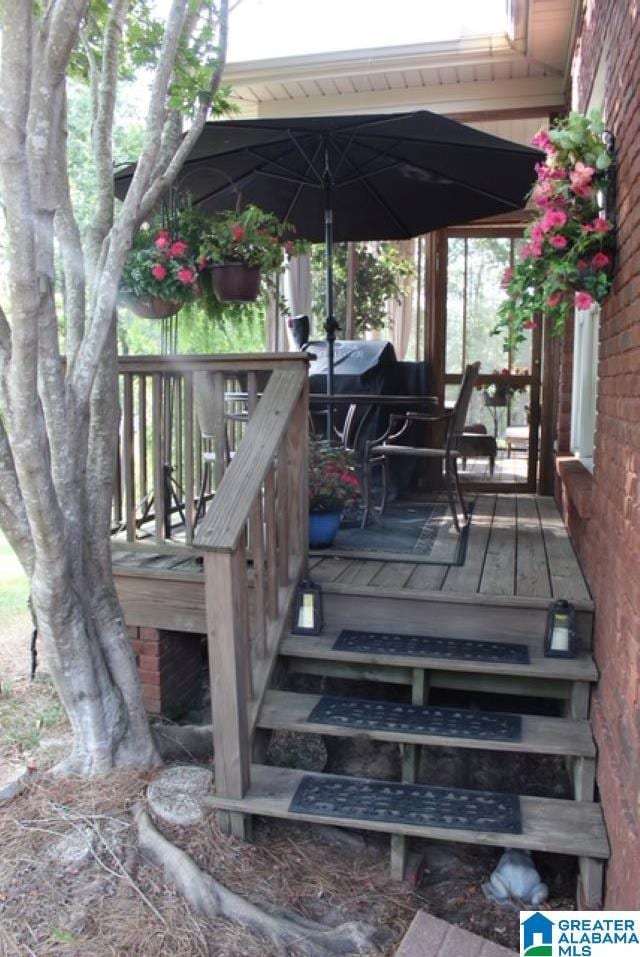 wooden deck with area for grilling