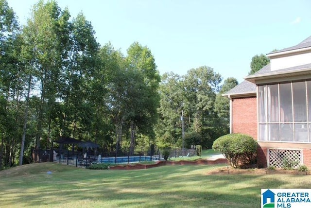 view of yard featuring a sunroom