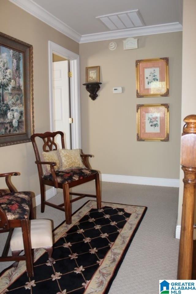 hall with carpet flooring and ornamental molding