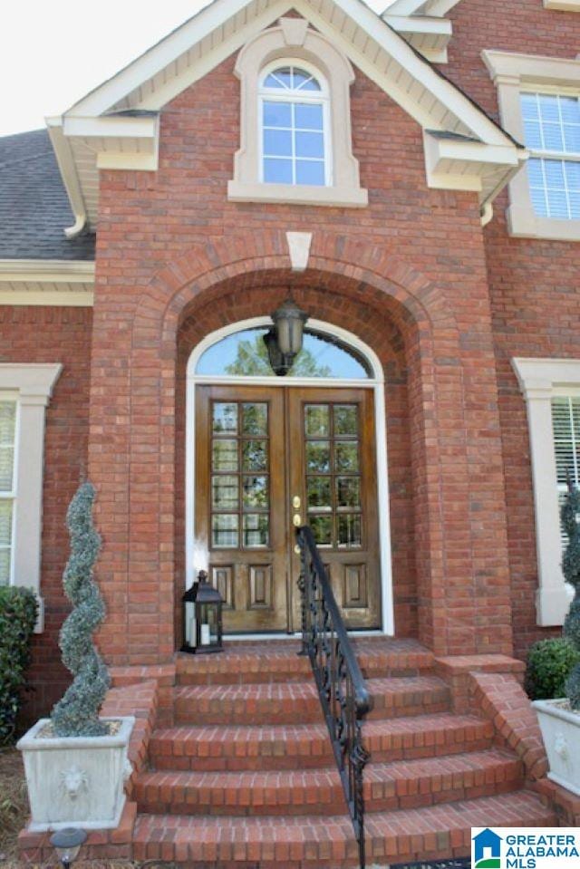 entrance to property featuring french doors