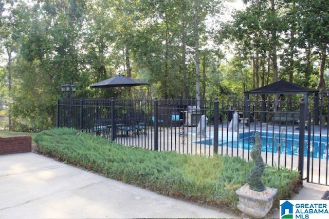 view of swimming pool with a gazebo