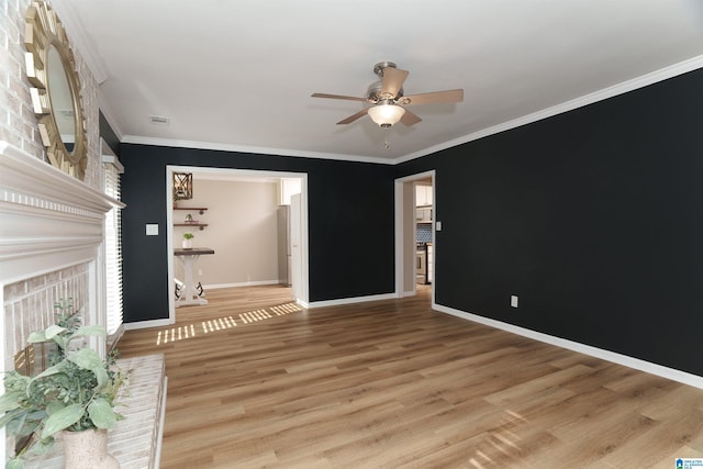 interior space with ceiling fan, hardwood / wood-style floors, and ornamental molding