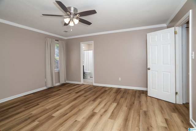 spare room with crown molding, light hardwood / wood-style flooring, and ceiling fan