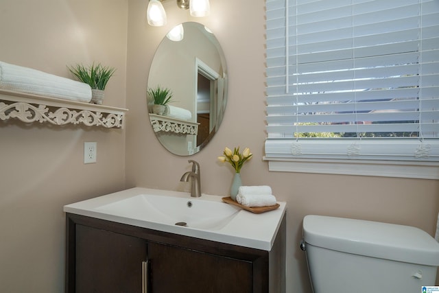 bathroom with vanity and toilet