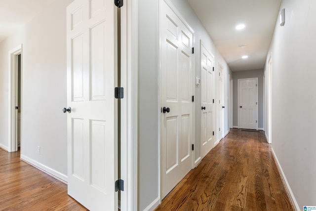 hallway featuring dark hardwood / wood-style floors