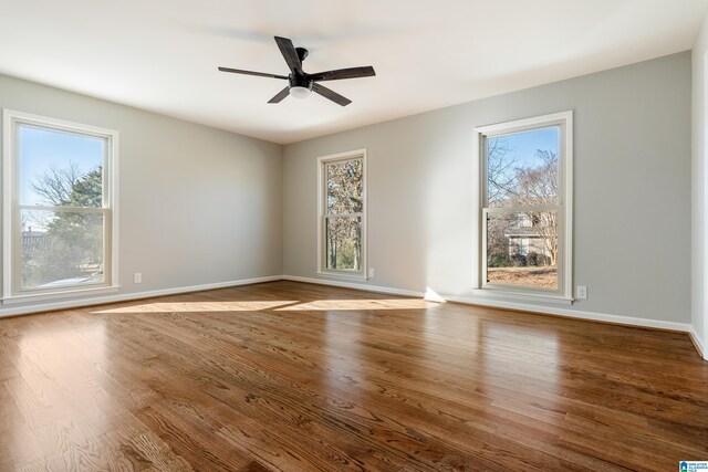 unfurnished room with hardwood / wood-style floors and ceiling fan