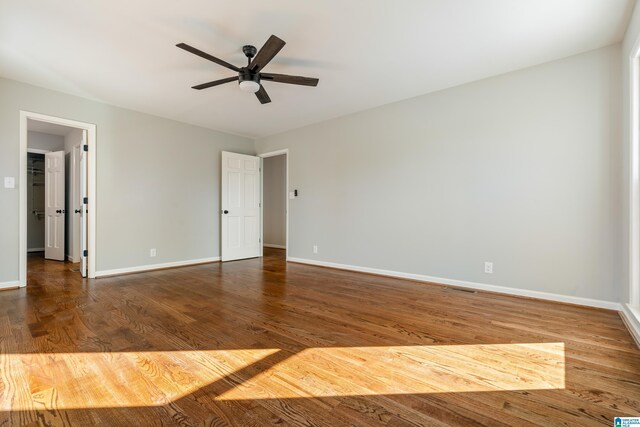 unfurnished room featuring hardwood / wood-style flooring and ceiling fan