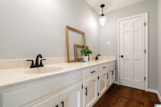 bathroom featuring vanity and hardwood / wood-style flooring