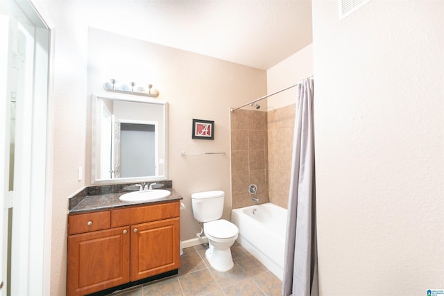 full bathroom featuring tile patterned flooring, vanity, shower / tub combo with curtain, and toilet