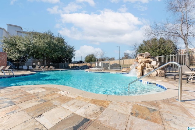 view of swimming pool featuring a patio and pool water feature