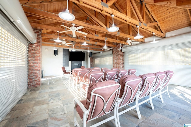 view of patio / terrace with ceiling fan and exterior bar