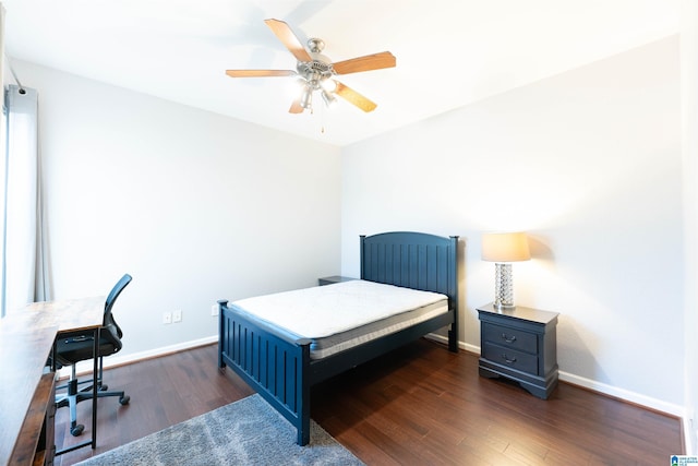 bedroom with dark wood-type flooring and ceiling fan