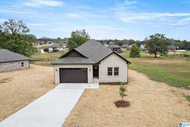 view of front of house with a garage and a front lawn