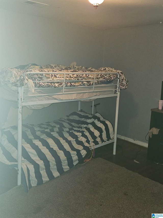 bedroom featuring dark colored carpet